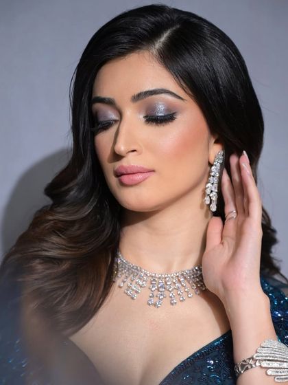 Another beautiful close-up of the eye makeup. The soft pink lip balances the dramatic eyes perfectly.