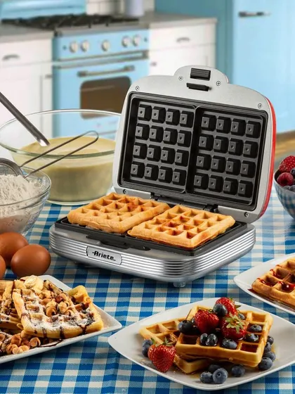 Making fresh, golden waffles with the Ariete party-time waffle maker. Its non-stick plates and classic American diner design make breakfast fun and easy.