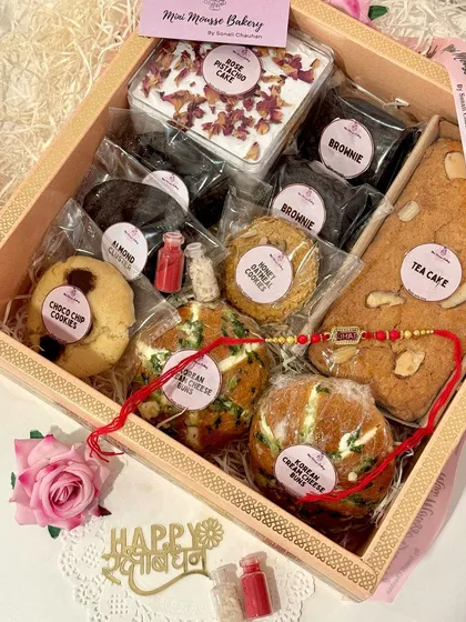 This is what a box full of happiness looks like. My Rakhi hampers are packed with a mix of my bestsellers, from soft Korean cream cheese buns and fudgy brownies to a whole tea cake and assorted cookies. It's the perfect way to show your siblings some love.