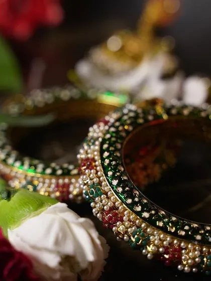 A macro shot of the intricate design on the bridal bangles. We love capturing these small but significant details that the bride has carefully chosen for her special day.