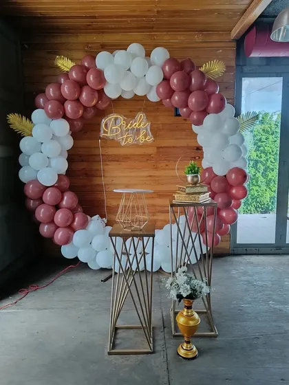 A straight-on view of the 'Bride to be' bachelorette party decoration. The combination of deep red and white balloons creates a classic and bold statement, suitable for both day and evening celebrations in Bengaluru.