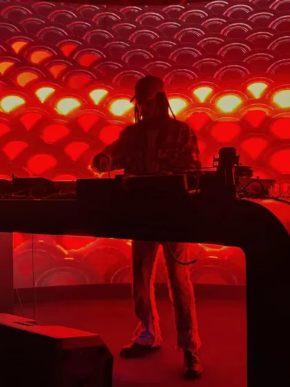 Setting the mood with dramatic red lighting. The right ambiance is key to building the energy for a great night of house and electro music.