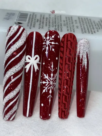 The full set of red and white Christmas nail designs, displayed together to show the variety of patterns.