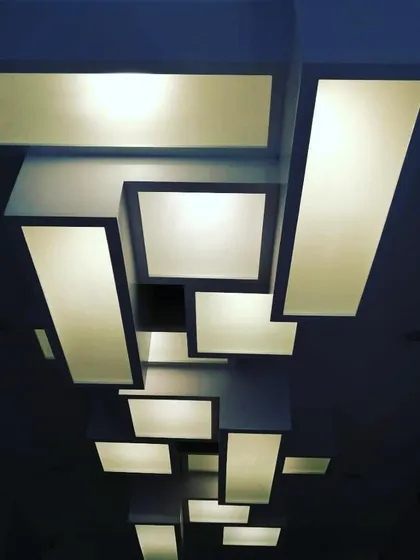 An example of our custom lighting design for a corporate office. This geometric luminaire is not just a light source but a sculptural ceiling installation, reflecting our belief that every detail, no matter how functional, should be an object of design.