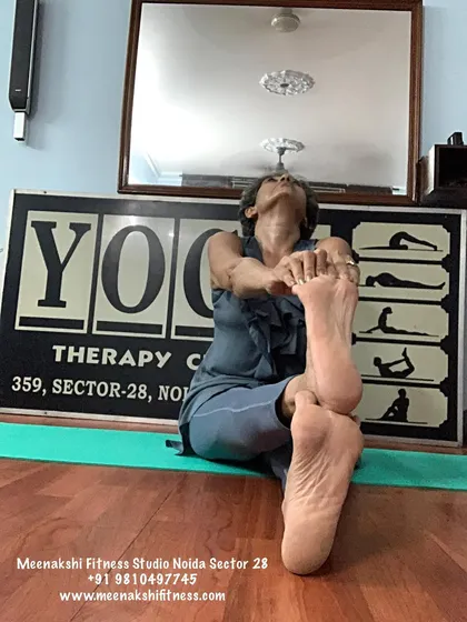 A seated figure-four stretch, which is a great modification for pigeon pose and deeply stretches the glute and piriformis muscles.