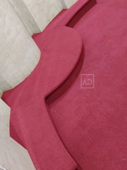 A close-up showing how I meticulously cut and fit the carpet around complex shapes and corners for a truly custom and professional finish.