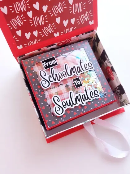 From schoolmates to soulmates, this scrapbook tells a beautiful love story. I created this piece with a romantic theme and a sparkling shaker window, perfect for celebrating a journey of love on Valentine's Day or an anniversary.