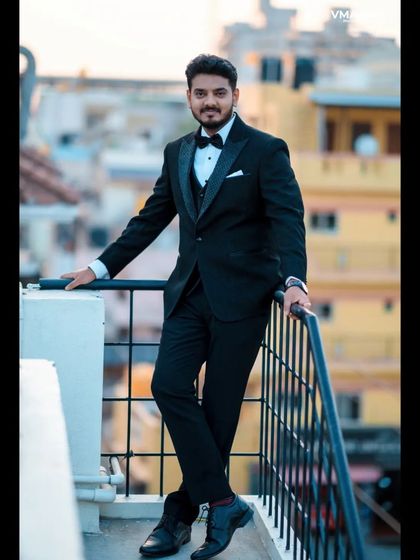 A duplicate of 15, another take on the stylish rooftop groom portrait.