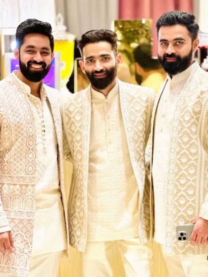 Three gentlemen, all dressed in my ivory Indo-Western designs. This image is a wonderful example of coordinated style for the groom and his groomsmen.