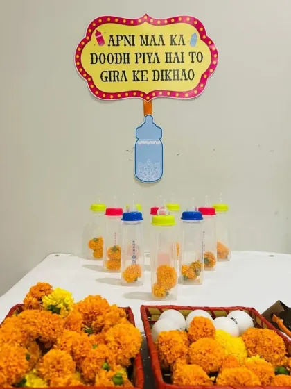 We believe every celebration needs a dose of fun. This quirky baby bottle bowling game, complete with a cheeky 'Apni Maa ka Doodh Piya Hai' sign, is just one example of how we add playful and memorable games to the party.