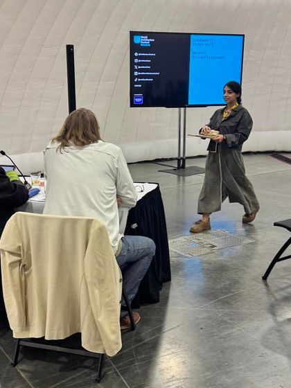 An architect presents her project to the jury at WAF. This is the moment where design concepts are scrutinized and celebrated, and I capture the intensity and passion of these presentations.