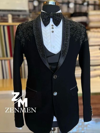A full shot of the black tuxedo with tonal floral embroidery. This is a perfect choice for someone who wants a detailed, luxurious look that remains understated and classic.