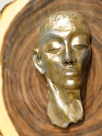 The evolution of a sculpture. This series shows a hand-built portrait bust from its raw clay form, to post-bisque firing, and finally with two different metallic glaze finishes.