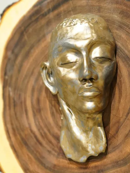 The evolution of a sculpture. This series shows a hand-built portrait bust from its raw clay form, to post-bisque firing, and finally with two different metallic glaze finishes.