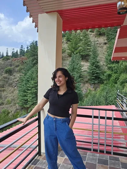 Feeling like a happy puppy on the balcony of our farm stay. The fresh mountain air and the stunning views of the pine-covered hills just fill my heart with joy.