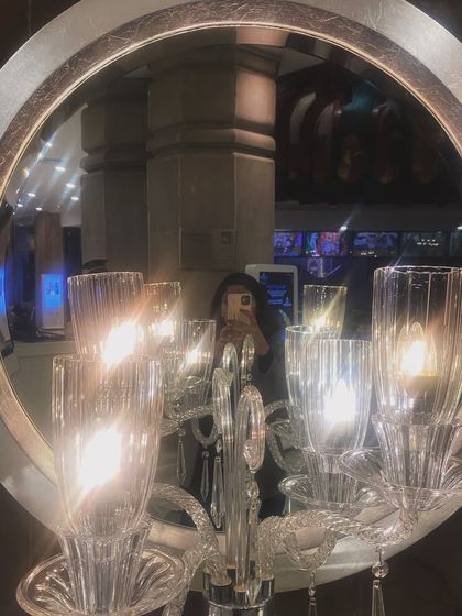 An artistic mirror selfie reflecting a crystal candelabra. This abstract and elegant shot showcases my eye for aesthetic compositions.