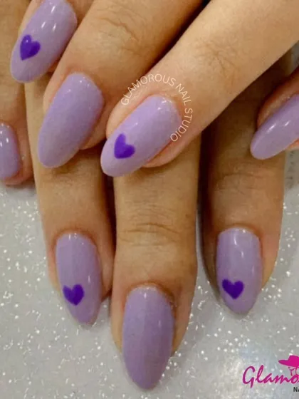 A lovely lavender set that's both sweet and simple. We used a beautiful pastel purple polish and added a single, darker purple heart to the accent nails for a cute and coordinated look.