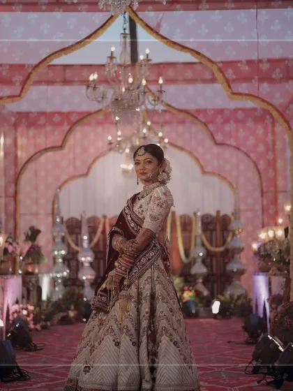 Radiant and stunning, our bride is pure magic inside the royal mandap we designed for her special day.