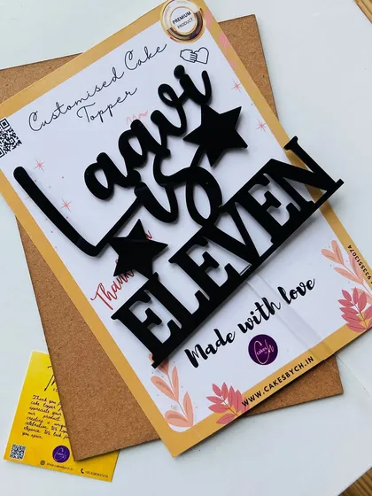For a bold and modern look, you can't go wrong with our black acrylic. This "Laavi is Eleven" topper uses a strong font with star accents, perfect for a cool, contemporary birthday party.