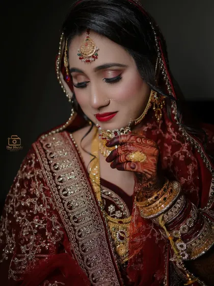 A close-up portrait focusing on the bride's stunning makeup and jewelry. We work closely with makeup artists to ensure every detail is captured perfectly.