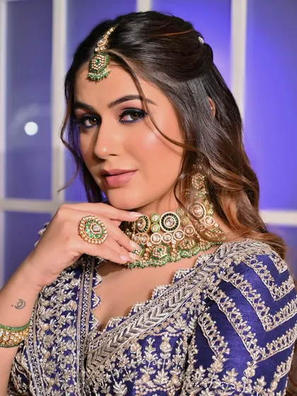 A close-up of the purple magic look. The bold eye makeup is the star of the show, complemented by glowing skin and a neutral lip to keep the look balanced and chic.