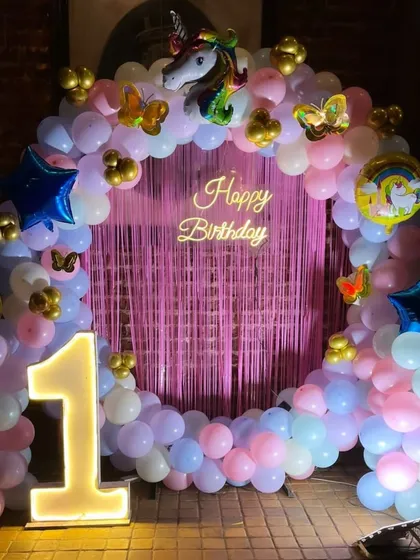 A clear, straight-on shot of the unicorn-themed ring backdrop, perfect for taking memorable party pictures.