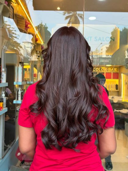 A global hair color transformation from dark to a rich, warm brown. The before and after shows the power of a single color to completely refresh your look.