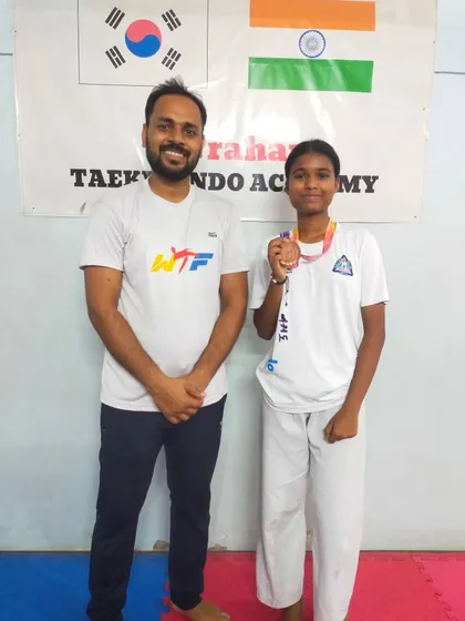 Our female junior athlete with her bronze medal from the Delhi State Championship. We have a strong contingent of female fighters in our academy.