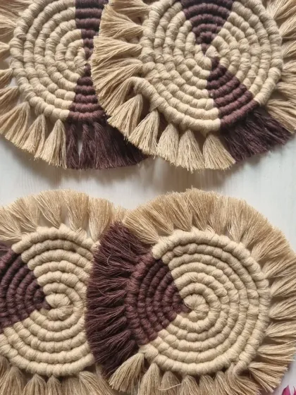 These two-toned brown and beige macrame coasters have a lovely, earthy feel. The spiral design is mesmerizing, and the fringe adds a soft texture.