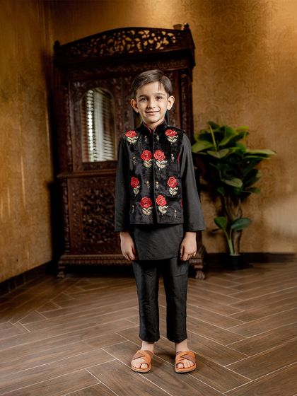 Another shot of our model looking dapper in the black and red rose Bundi set. It’s a versatile piece that’s perfect for Diwali, weddings, or any festive party.