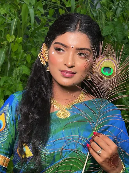 Another angle of the Radha look, highlighting the side profile and the intricate details of the makeup and jewelry.