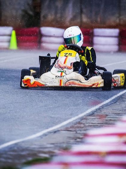 Navigating a wet track during the Meritus Cup, a true test of driver skill.