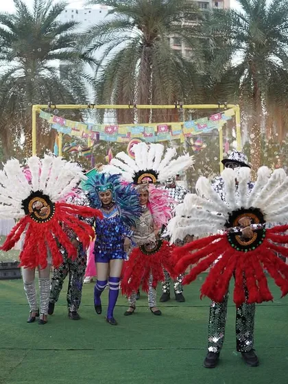 The arrival of the carnival performers, dressed in incredible flower-like costumes. I work with top entertainment agencies to bring unique and visually stunning acts to my events.