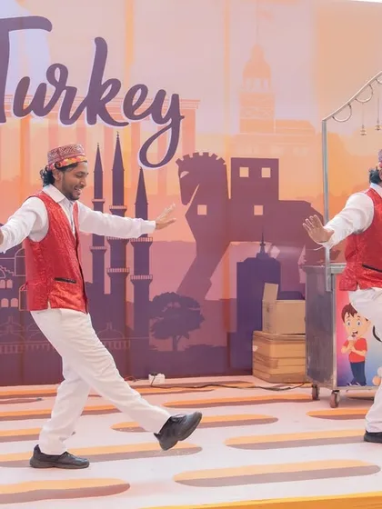A taste of Turkey at our 'World Tour' carnival. These dancers, in traditional Turkish attire, performed a lively folk dance, adding an authentic and entertaining element to the themed event.
