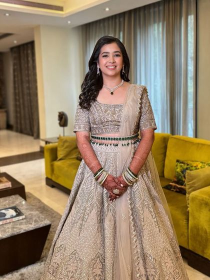 Priya's engagement look was elegant and understated. Her beautiful gown was paired with soft waves and a natural makeup look.