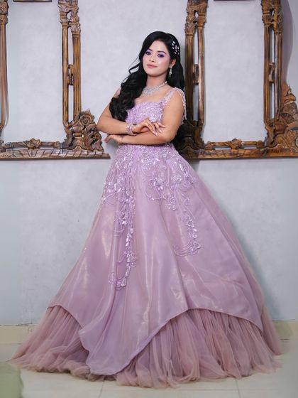 Another full-length shot of the lilac gown, showing its princess-like silhouette.