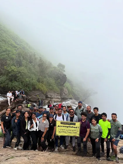 Another successful group at the top of Bandaje Falls, holding our banner.