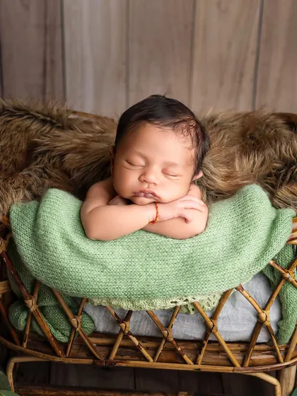 To the most gorgeous little boy. I love using earthy tones like green, which complement a rustic wooden backdrop and bring a natural feel to the portrait.