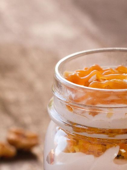 Our Carrot Walnut Jar is a deconstructed classic. We layer moist carrot cake, creamy frosting, and crunchy walnuts in a convenient jar for a delightful dessert experience.