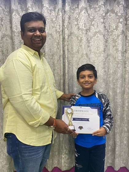 Presenting a certificate and trophy to Vivaan Bagal for his achievement in our abacus program.