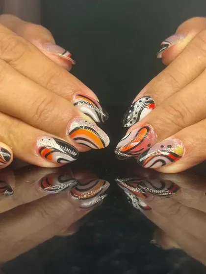 A vibrant and abstract design with swirls of orange, black, and white.