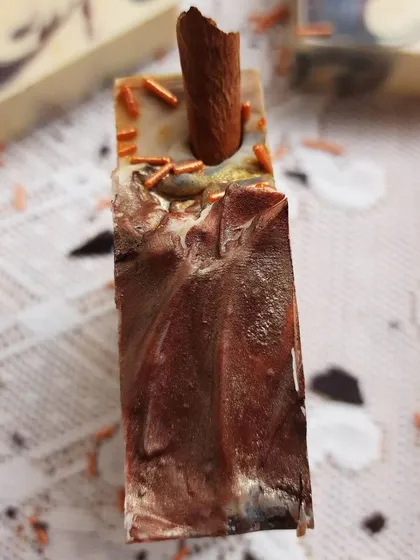 The top of the Hot Cinnamon Cocoa soap is textured and decorated with a real cinnamon stick and sprinkles. It's a festive bar that's perfect for gifting.