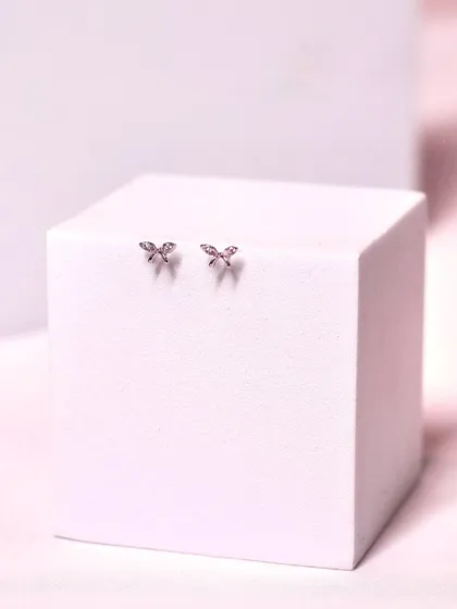 Tiny butterfly studs, perfect for a subtle touch of whimsy and elegance. These are great for second or third lobe piercings.