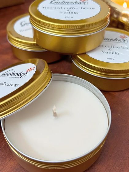 A close-up of the coffee and vanilla tin candle, showing the simple and clean label design.