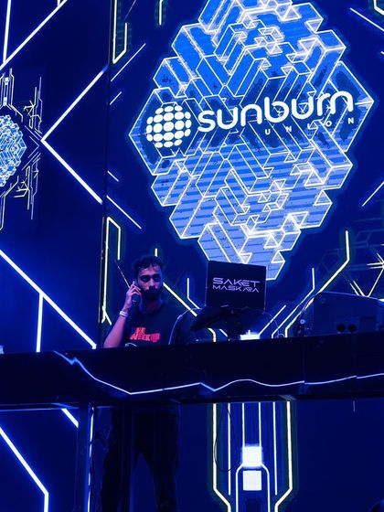 On the phone, likely coordinating the next move, but always in the zone.