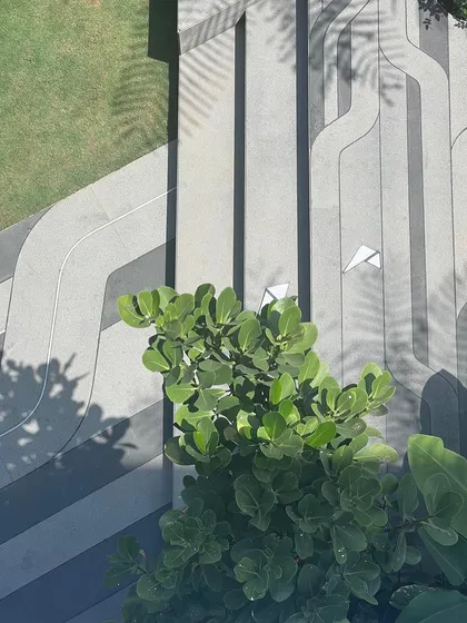 The finished floor pattern with sunlight casting shadows, showing how the design comes to life and interacts with its environment.