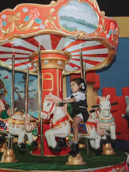A classic carousel ride adds a touch of timeless carnival fun to the 'Adventureland' zone. I like to mix modern attractions with nostalgic favorites.