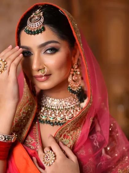 This shot highlights the beautiful jewelry and how the makeup complements it. The defined eyes and soft lips create a look of timeless elegance and grace.
