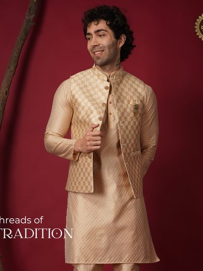Threads of tradition. A full look of a groom in a beige patterned Nehru jacket and kurta, a timeless and sophisticated choice.