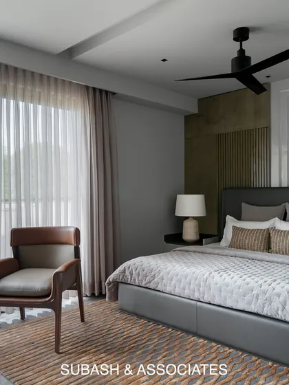 This minimal contemporary bedroom is a serene retreat. Clean lines, a soft color palette, and a private balcony create a tranquil space to unwind.